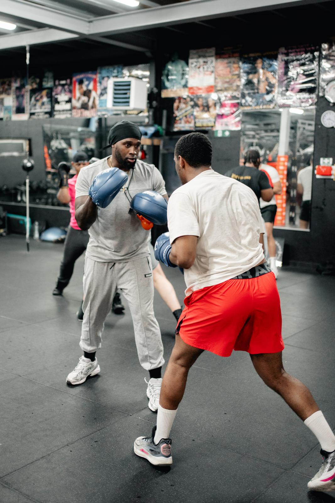Pad work with a coach during an LBDA strength and conditioning session
