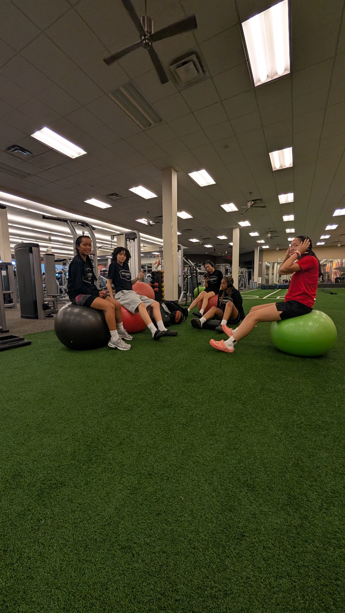 Athletes on exercise balls during a strength and conditioning block
